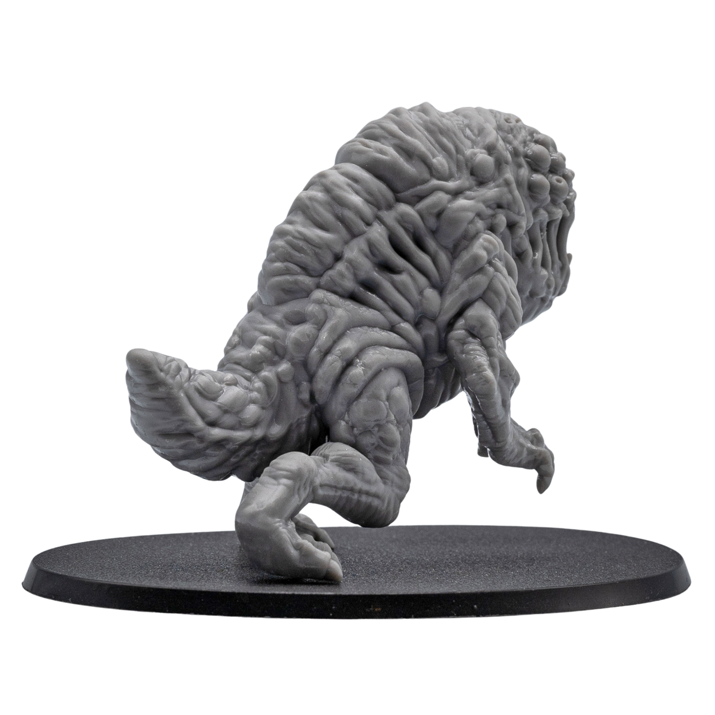Back angle view of an unpainted Aberration fantasy monster miniature showing detailed organic sculpting, tail section, and oval base.