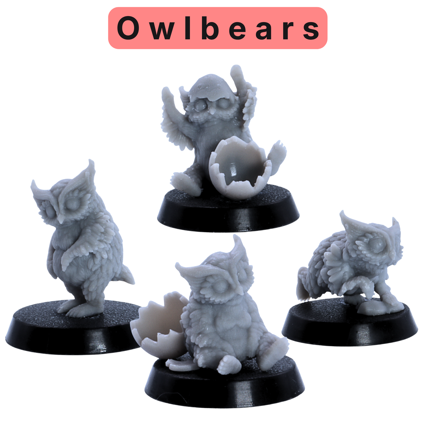 Unpainted owlbear miniatures from the Baby Dragons and Monsters set showing small owl-like fantasy creatures with eggshell accessories.