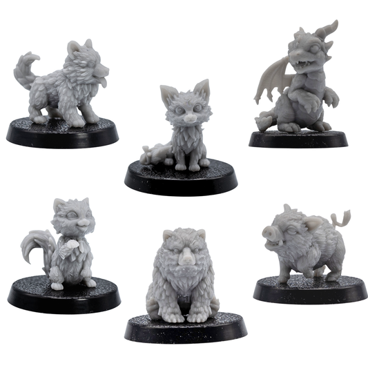 Unpainted set of six Fantasy Familiars showing the puppy, fox, cat, baby boar, bear cub, and wyrmling.