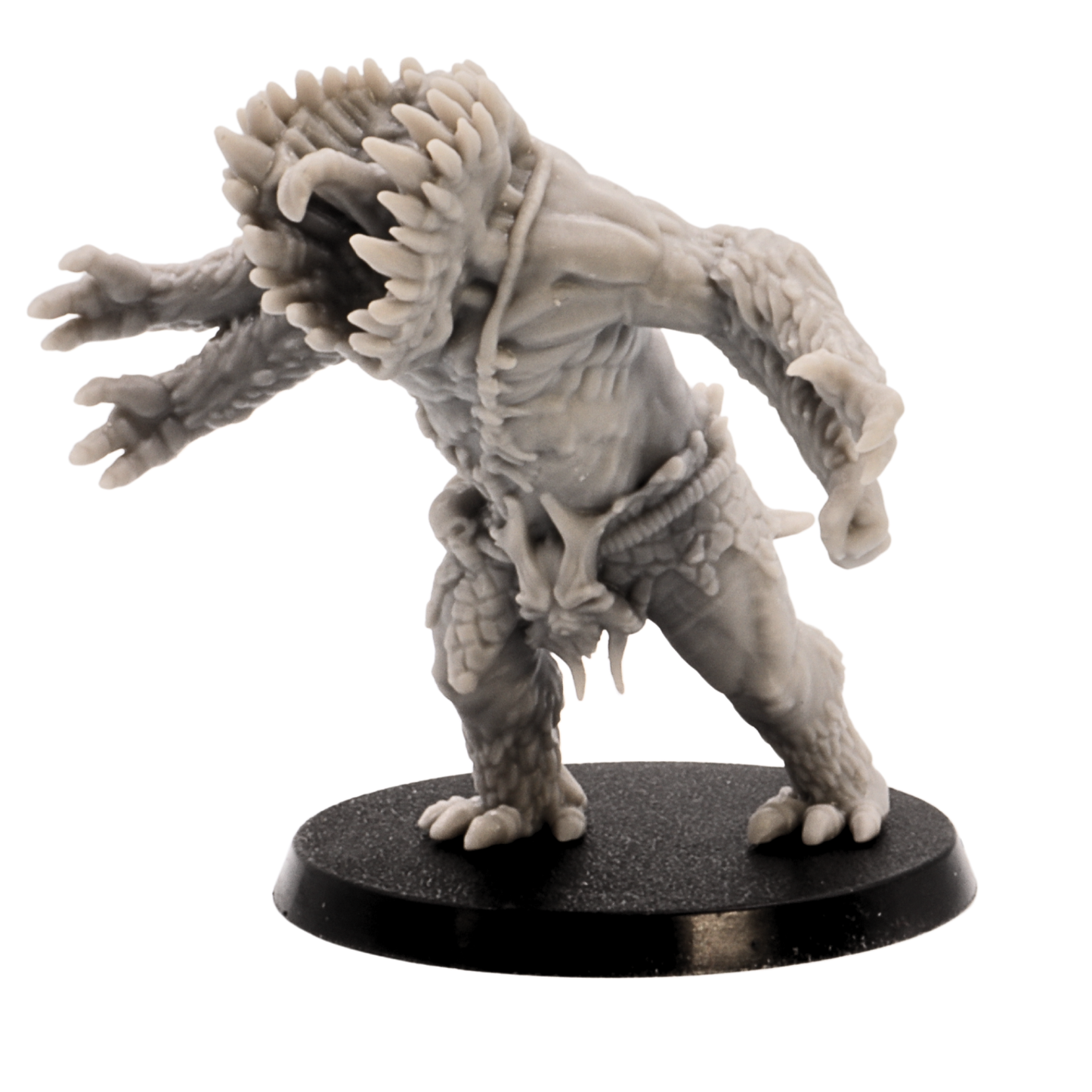 Close front view of an unpainted Gug Monster miniature with open vertical jaws, sharp teeth, and clawed limbs.