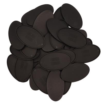 Collection of black 90x52mm oval miniature bases with smooth edges and textured tops.