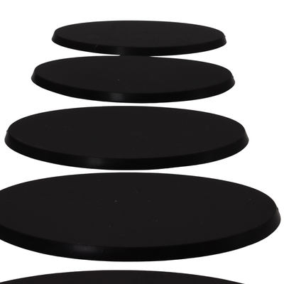 Side profile of black 90x52mm oval bases showing the approximately 4mm base height.