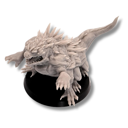 Top angle view of unpainted Basilisk showing spiked back, tail, claws, and scaled body