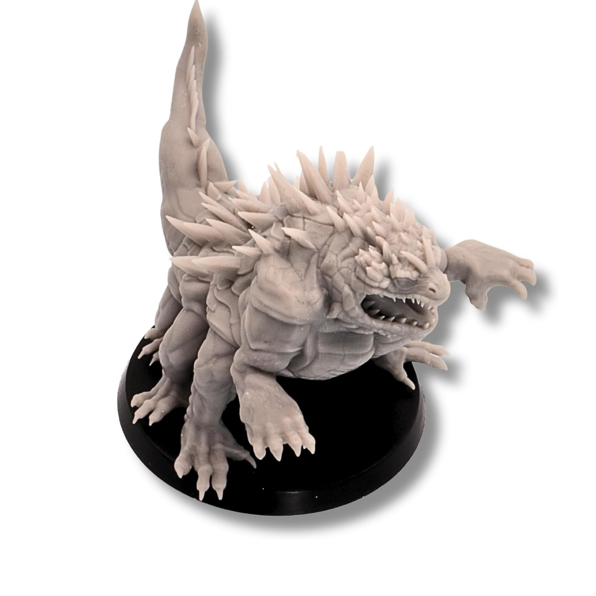 Angled view of unpainted Basilisk monster miniature on a 60mm round base