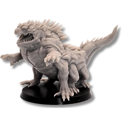 Unpainted Basilisk miniature with open mouth, claws, scales, and dorsal spikes