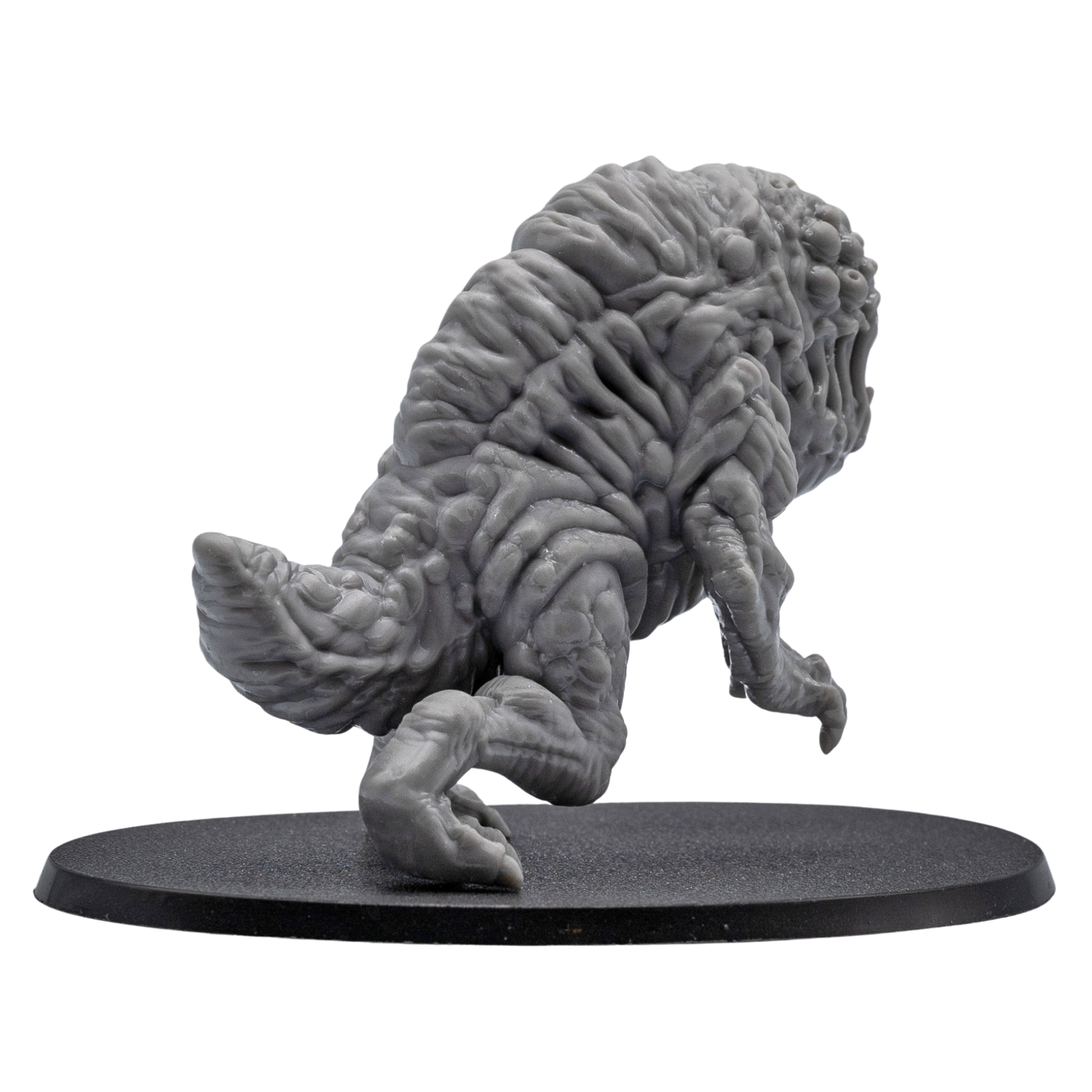 Back angle view of an unpainted Aberration fantasy monster miniature showing detailed organic sculpting, tail section, and oval base.