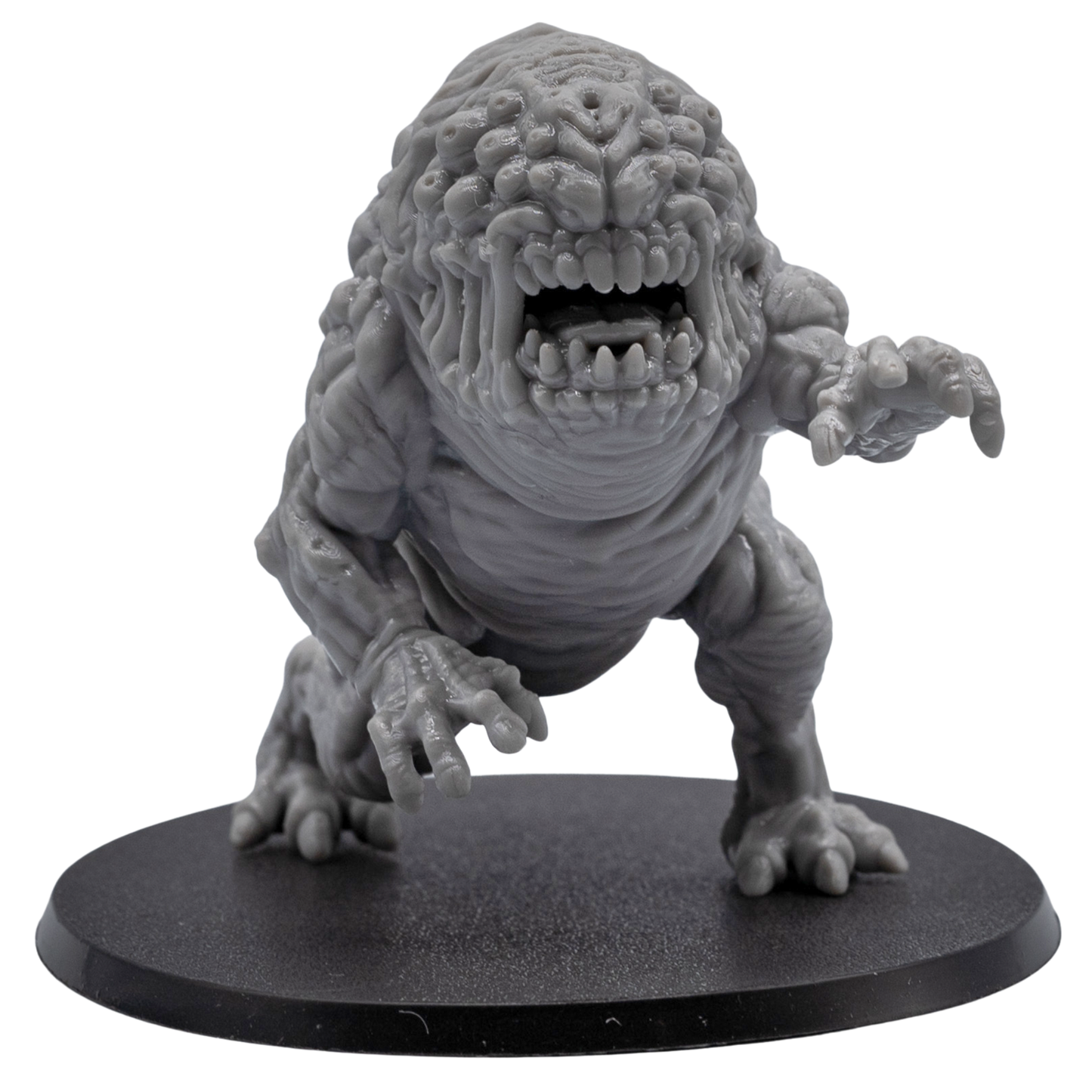 Close front view of an unpainted Aberration monster miniature showing fanged mouth, eye cluster, clawed hands, and detailed sculpt.