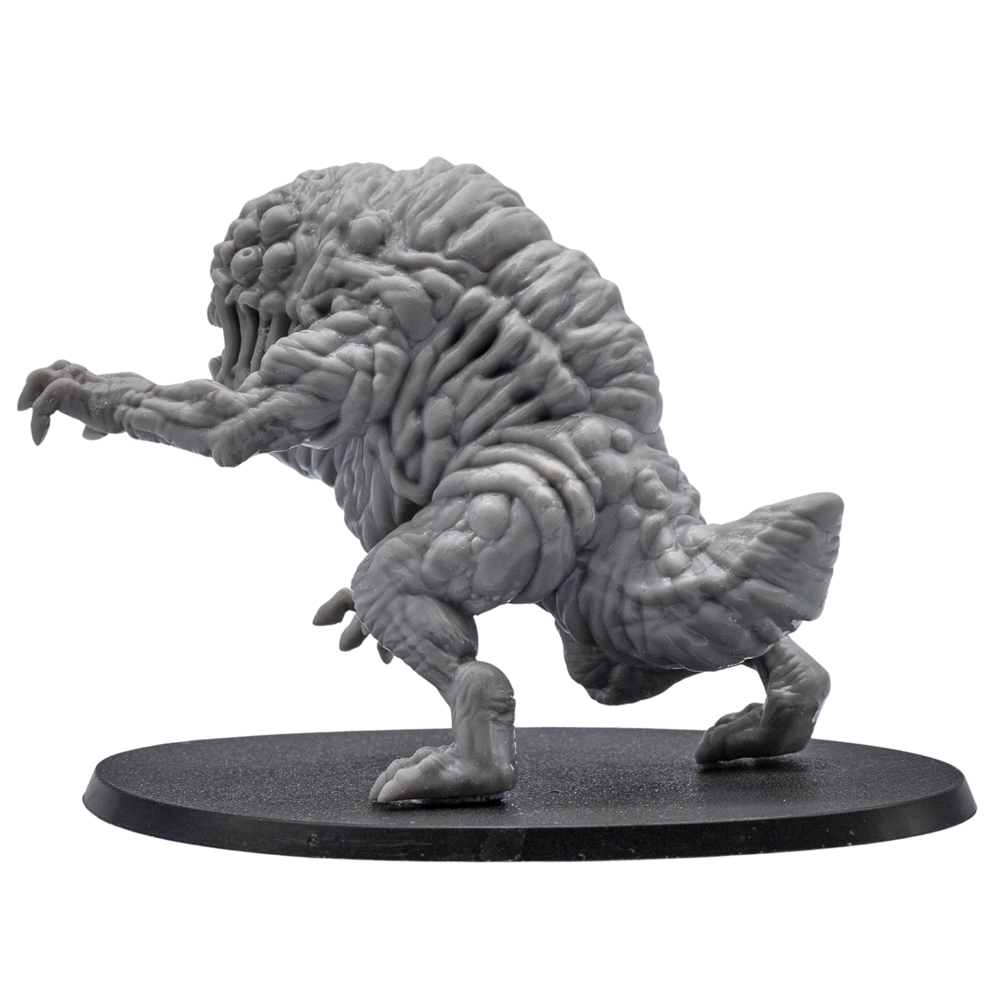 Rear view of an unpainted Aberration resin miniature showing wrinkled back texture, rear limbs, tail, and large oval base.