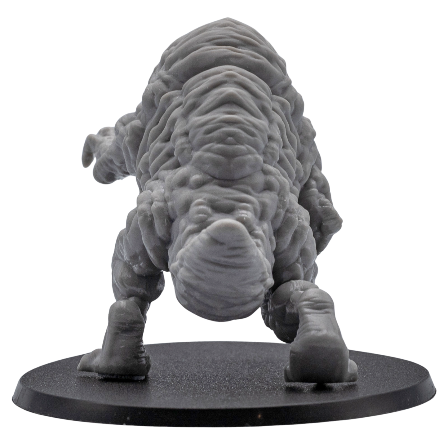 Side angle view of an unpainted Aberration monster miniature with exposed muscle-like sculpting, claws, eye cluster, and oval base.