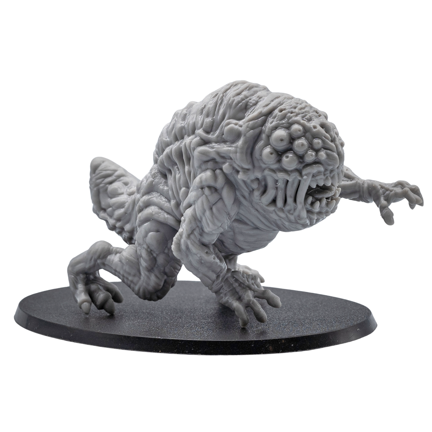 Front angle view of an unpainted Aberration resin miniature showing multiple eyes, open mouth, claws, and oval base.