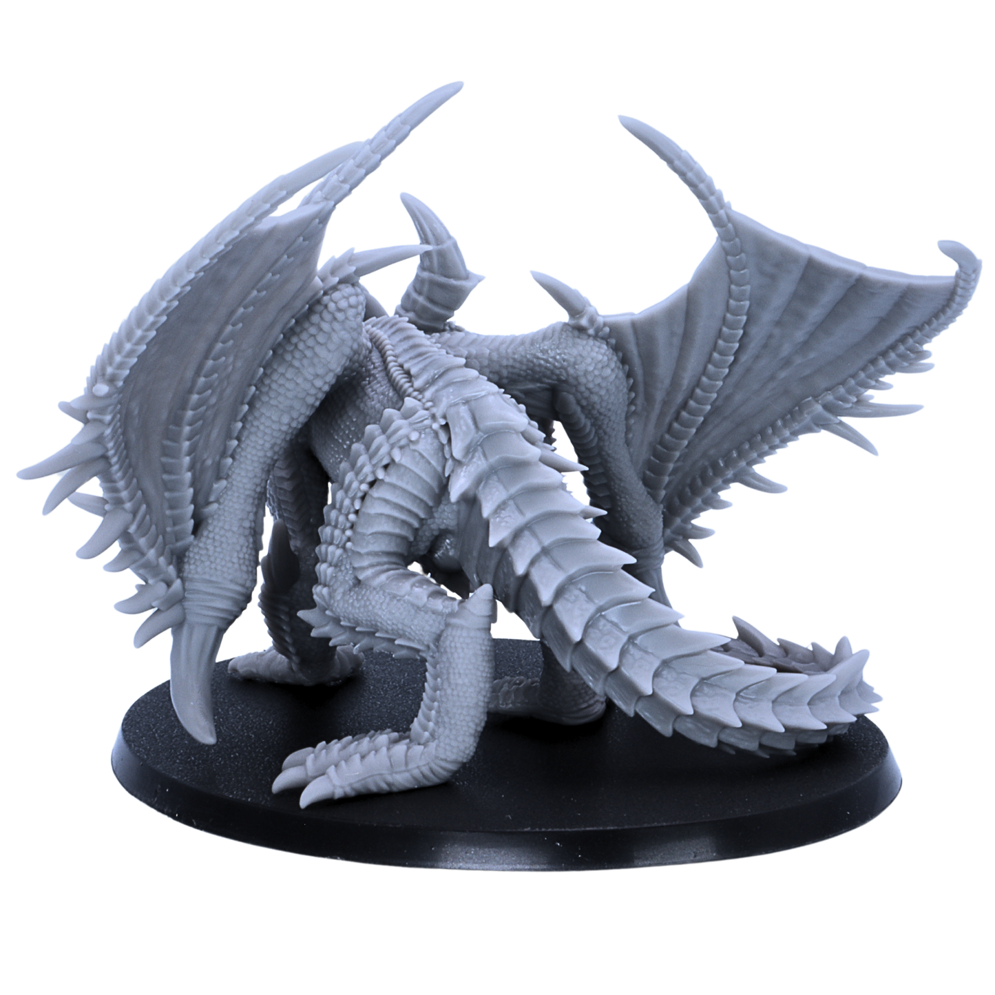 Back view of the Adult Iron Dragon miniature showing folded wings, long tail, layered scales, and detailed rear sculpt.
