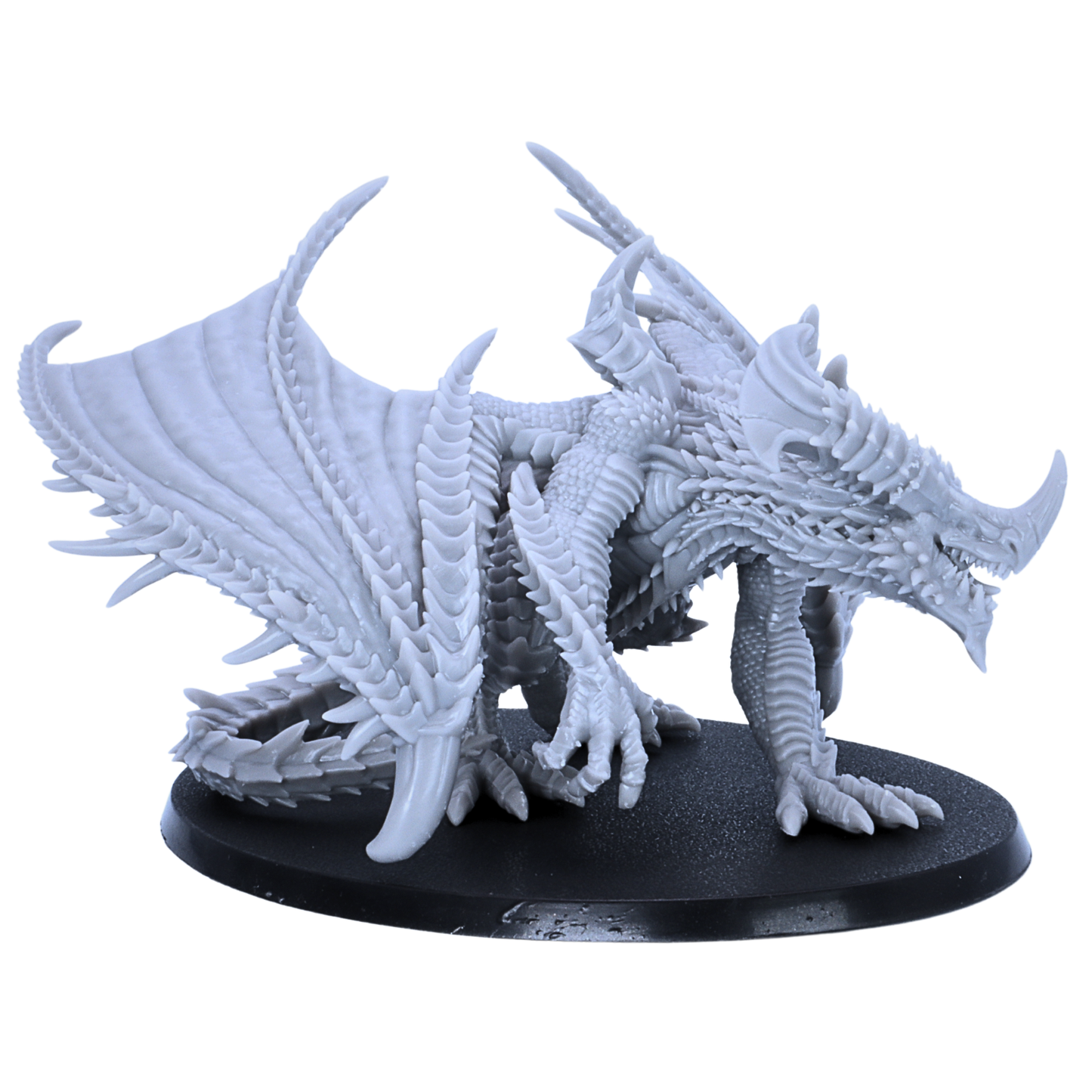 Side angle view of an unpainted Adult Iron Dragon miniature with layered scales, large wings, long horns, and crouched dragon pose.