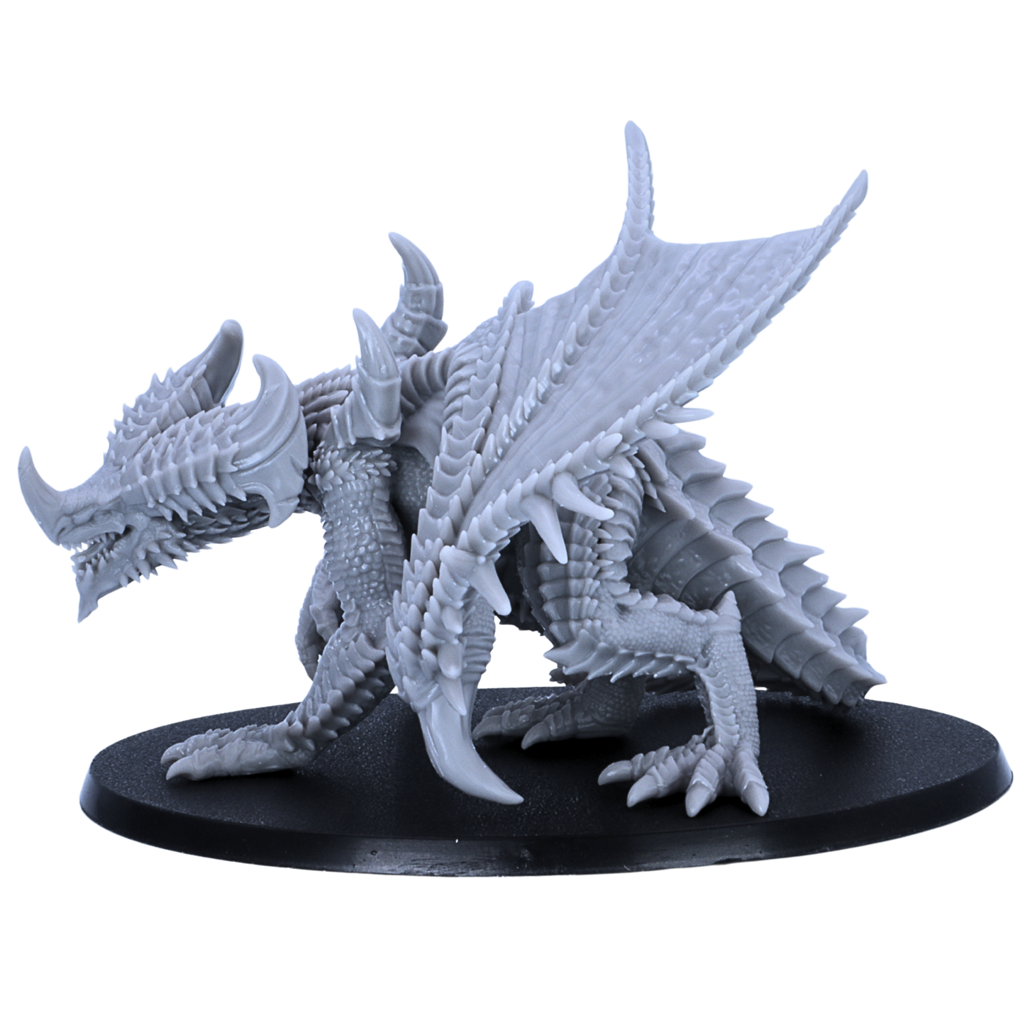 Side view of an unpainted Adult Iron Dragon resin miniature by Epic Miniatures showing spiked wings, horns, claws, and oval base.