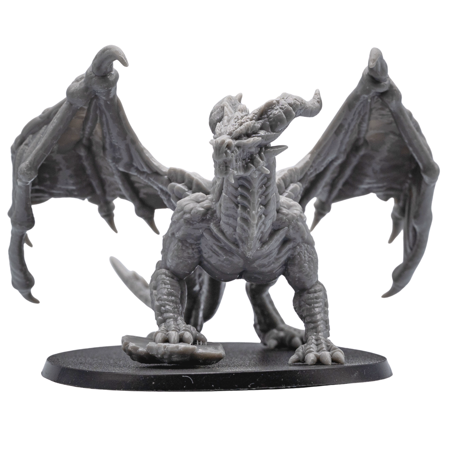 Unpainted Adult Red Dragon miniature front view showing wings, horns, scales, claws, and detailed dragon head.