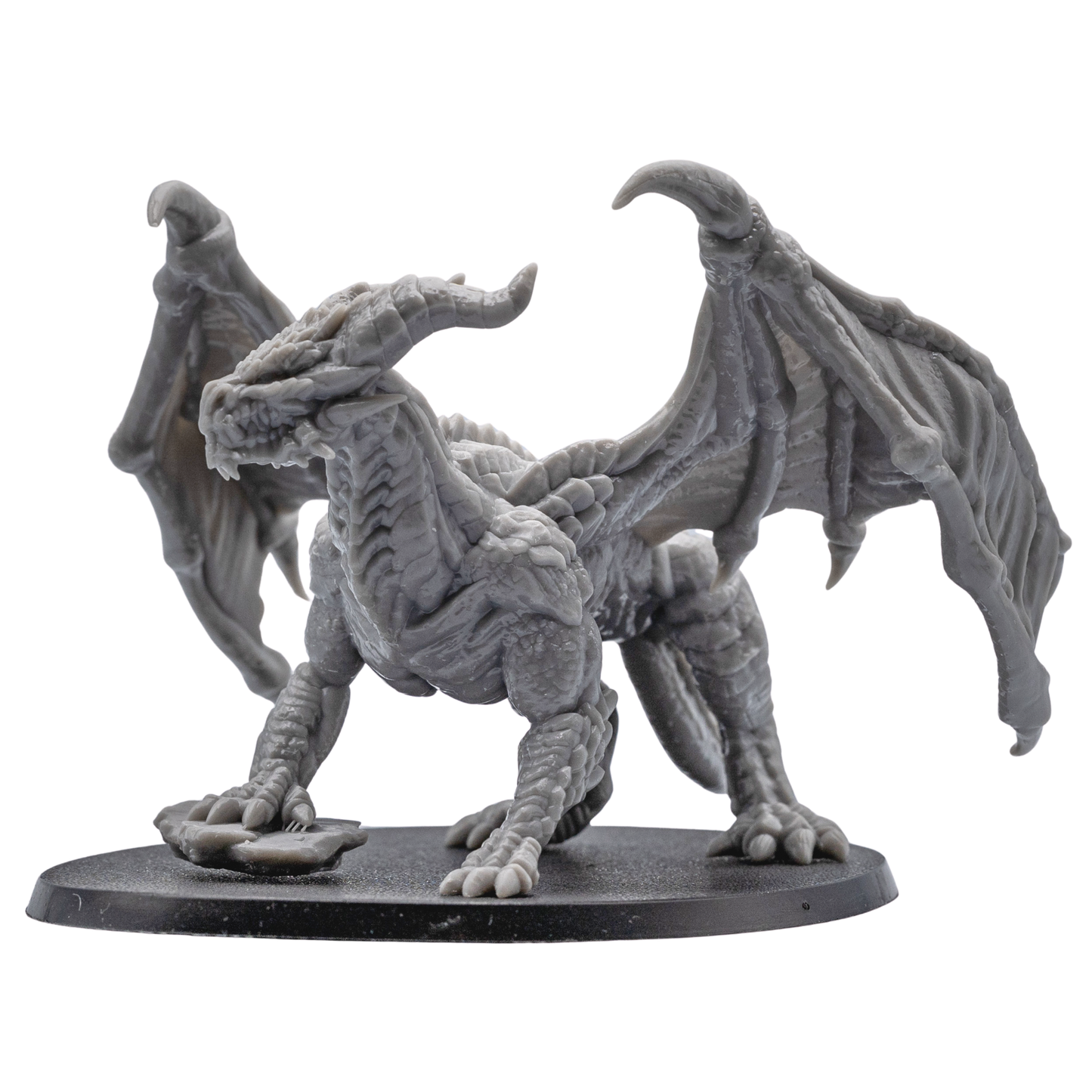Rear angle view of the unpainted Adult Red Dragon miniature showing detailed wings, tail, and dragon scales.