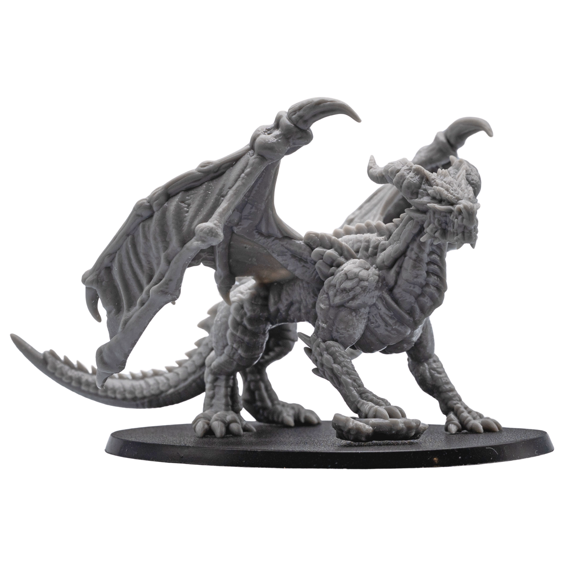 Side view of the unpainted Adult Red Dragon miniature by Forged Path Miniatures on an oval base.