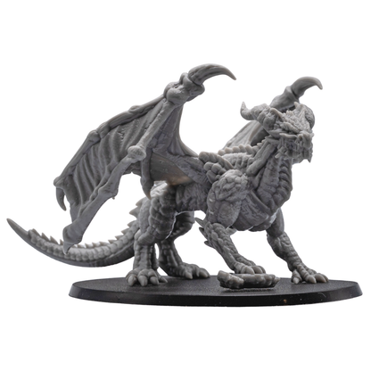 Side view of the unpainted Adult Red Dragon miniature by Forged Path Miniatures on an oval base.