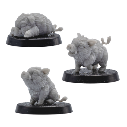Front angle view of three unpainted Baby Boar Familiar resin miniatures showing standing, sitting, and sleeping poses on round bases.