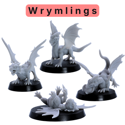 Unpainted wyrmling miniatures from the Baby Dragons and Monsters set, showing small winged dragon poses on round bases.