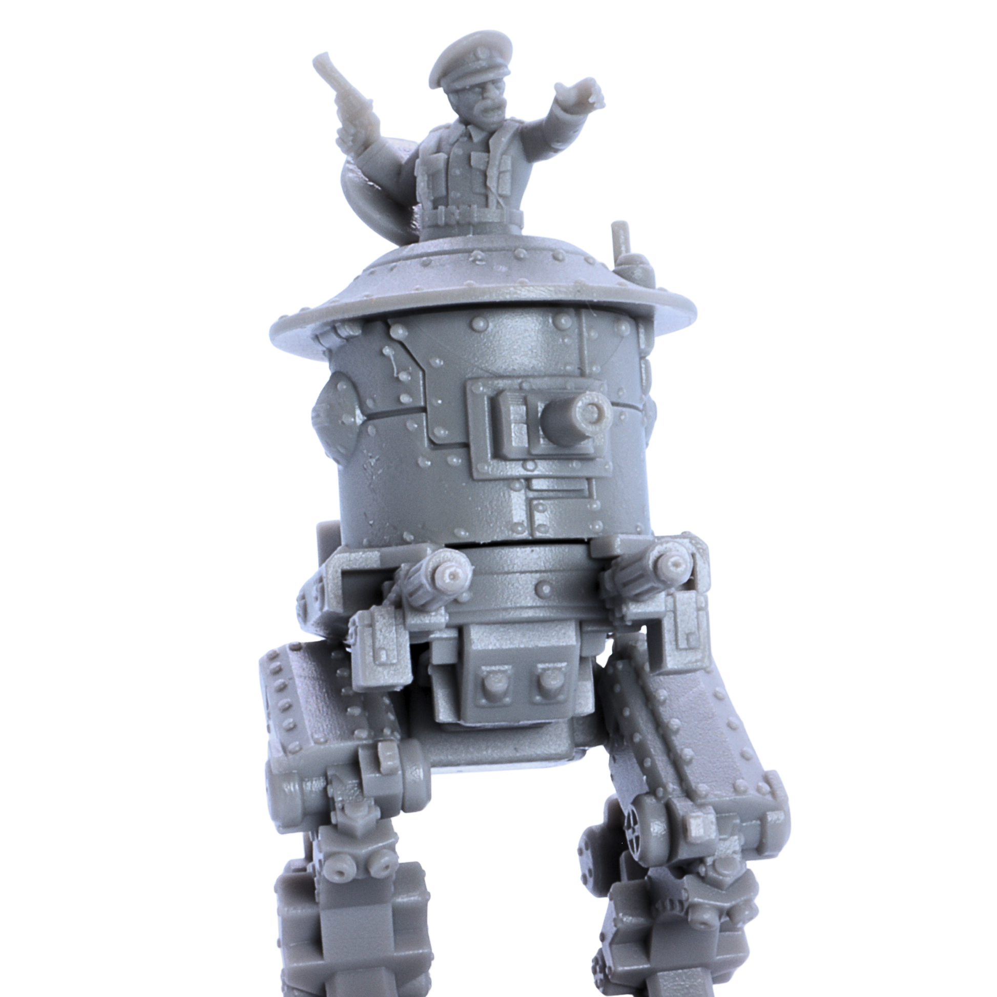 Close-up of the unpainted British MK1 Sentinel Heavy Tank miniature showing riveted armor, front cannon, and commander figure.
