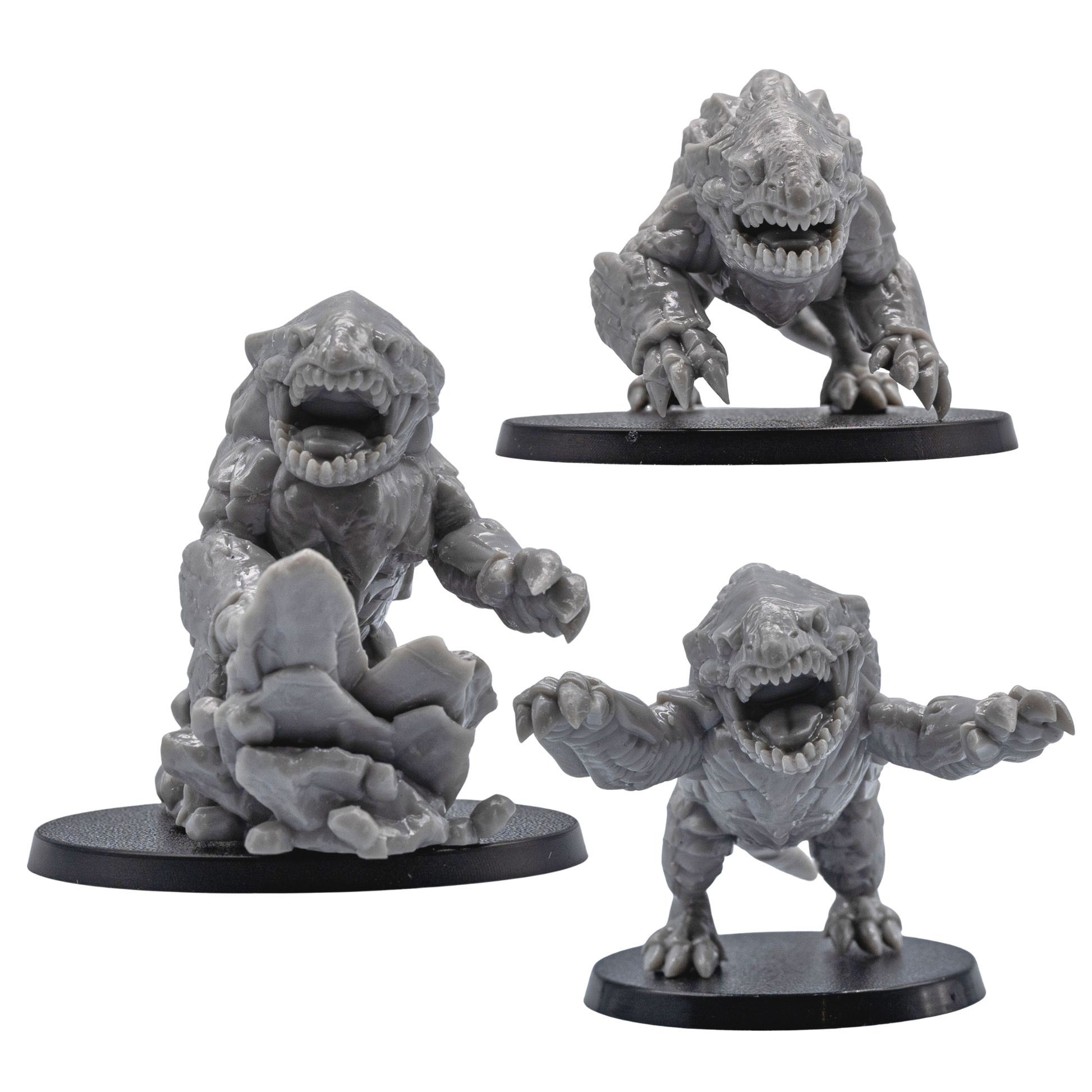 Front views of unpainted Bulette creature miniatures showing open jaws, claws, armor plates, and resin sculpt detail.