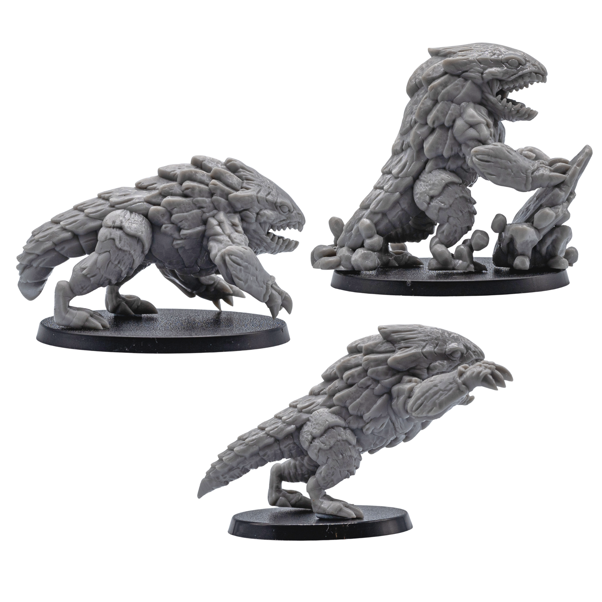 Profile views of unpainted Bulette fantasy creature miniatures with plated armor, claws, open mouths, and dynamic poses.