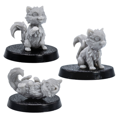 Unpainted Cat Familiars set showing three fluffy cat miniatures in different poses on round bases.