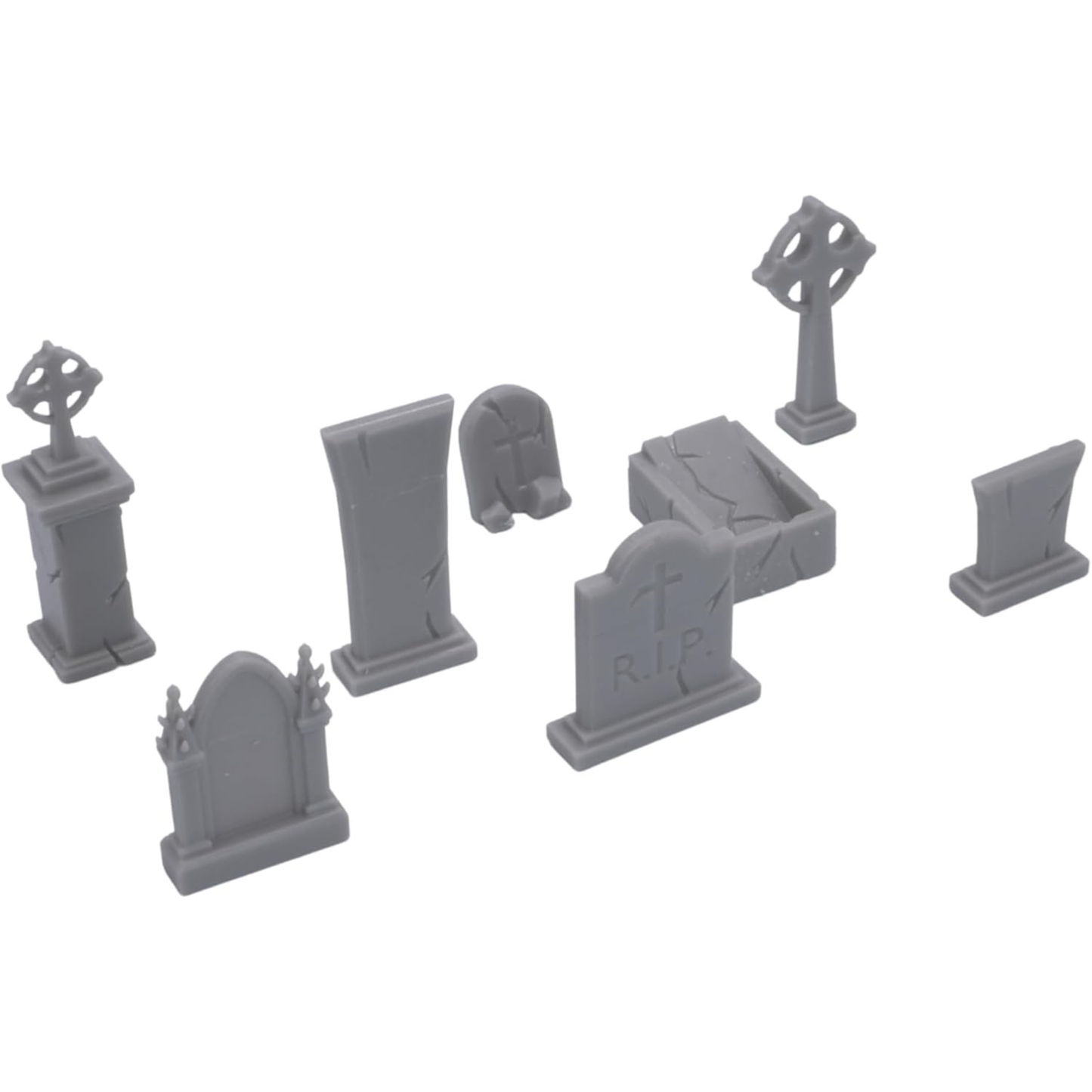 Printable Scenery cemetery terrain pieces arranged as a fantasy graveyard display