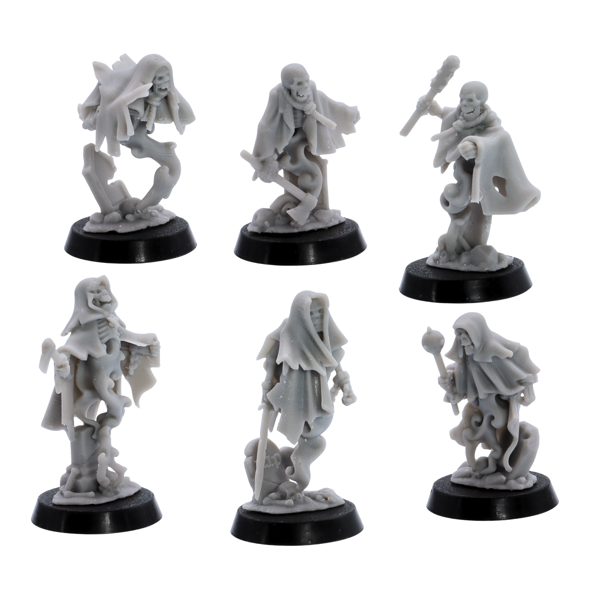 Unpainted Crypt Ghost miniatures showing six varied undead spirit poses with skeletal faces, torn cloaks, weapons, and spectral bodies.