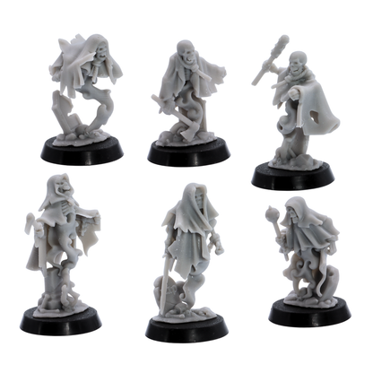 Unpainted Crypt Ghost miniatures showing six varied undead spirit poses with skeletal faces, torn cloaks, weapons, and spectral bodies.