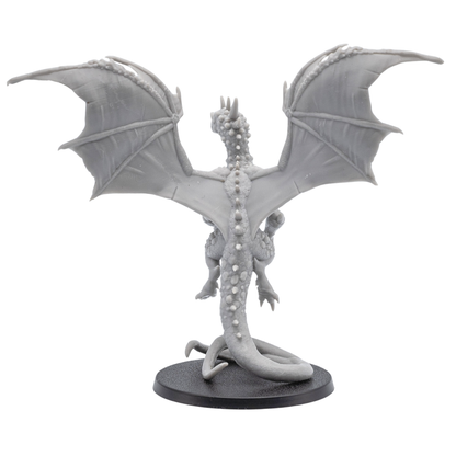 Back angle view of the Crystal Dragon miniature showing wide wings, long tail, crystal-like back details, and rear sculpting.