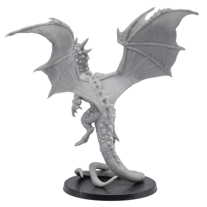 Back view of an unpainted Crystal Dragon miniature showing outstretched wings, raised tail, rear body detail, and 60mm round base.
