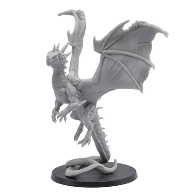 Rear wing detail view of an unpainted Crystal Dragon miniature showing large wing membranes, spine texture, and upright dragon pose.