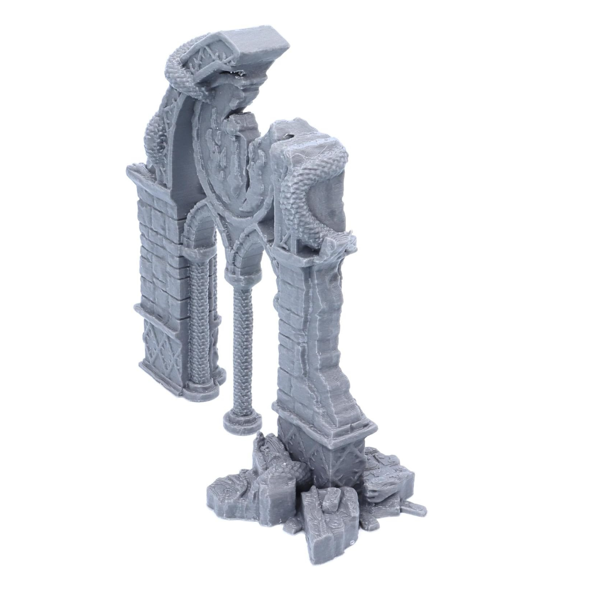 Left angled view of the Dragon Archway showing broken masonry, pillars and coiling dragon decoration