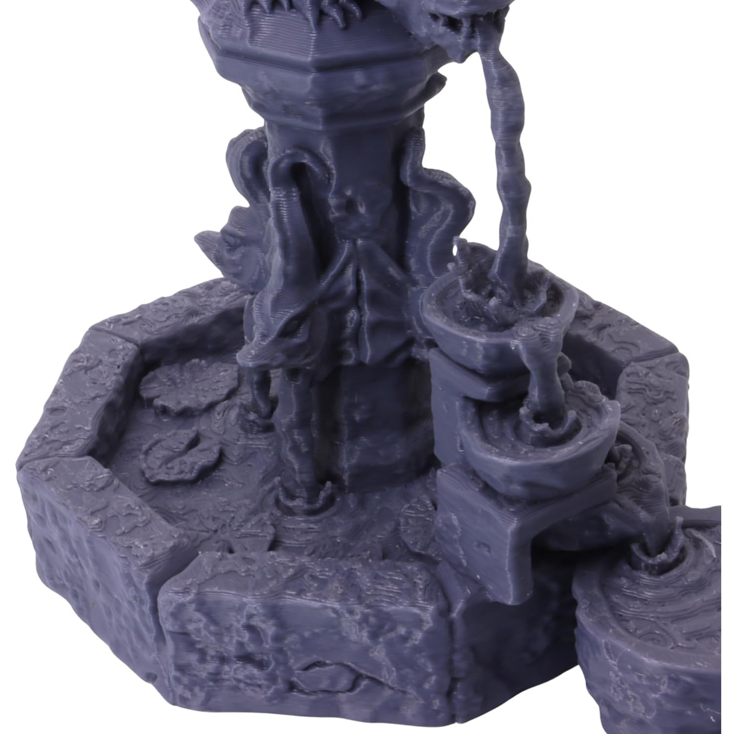 Detailed view of the central fountain column, carved ornamentation and flowing water elements.