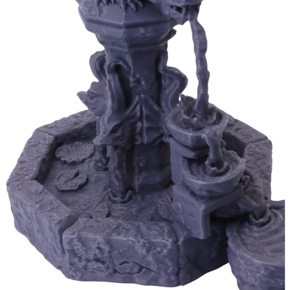 Detailed view of the central fountain column, carved ornamentation and flowing water elements.