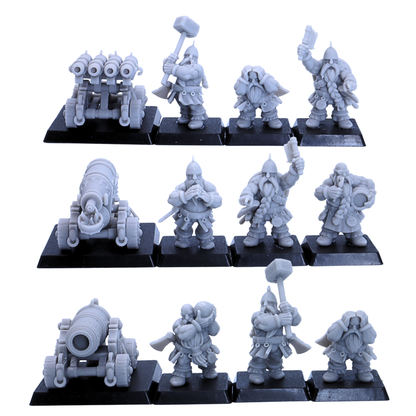 Unpainted dwarf artillery lineup showing cannon crew, organ gun crew, flamethrower crew, and square bases in 32mm scale.