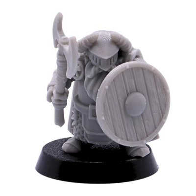 Close view of an unpainted helmeted dwarf warrior miniature with round wooden shield detail.