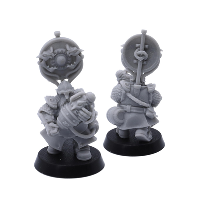 Unpainted Dwarf Fire Spitters banner miniature with shield and powder keg details shown from multiple angles.