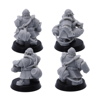 Rear detail views of unpainted Dwarf Fire Spitters miniatures showing armour, packs, barrels, and equipment.