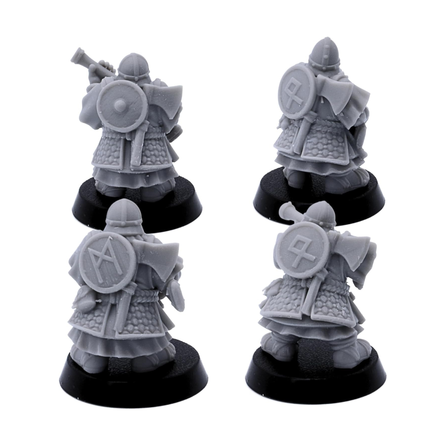 Rear views of unpainted Dwarf Gunners showing armour, shields, cloaks, and equipment details.