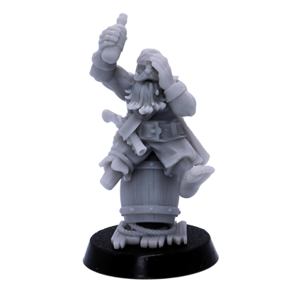 Unpainted dwarf pirate miniature sitting on a barrel and raising a bottle.