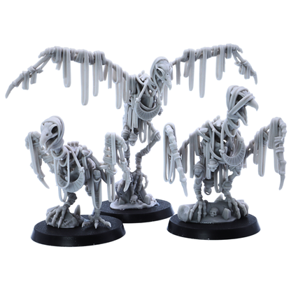 Three unpainted Egyptian Vulture miniatures displayed together, featuring undead bird designs with skeletal wings and ancient Egyptian styling.