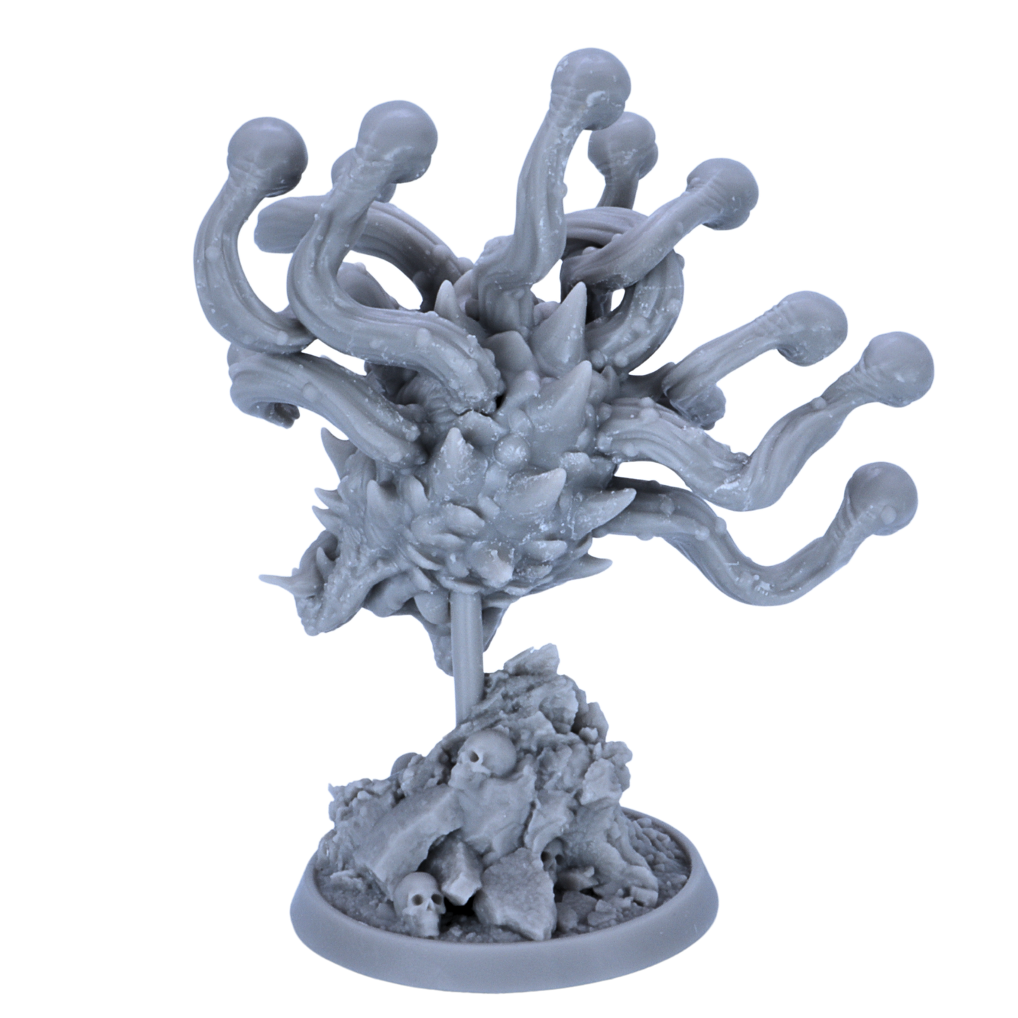 Unpainted Eye Tyrant miniature showing rear detail of eye stalks, spiked body, and skull-covered dungeon base.