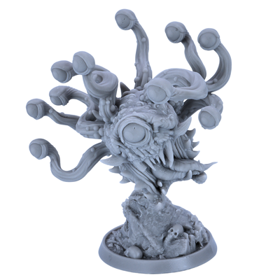 Unpainted Eye Tyrant miniature showing front view with central eye, teeth, tusks, eye stalks, and rocky base details.