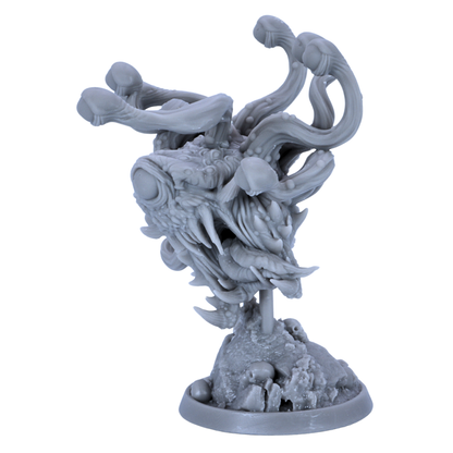 Unpainted Eye Tyrant miniature showing rear view with twisting eye stalks, spines, and detailed rocky base.