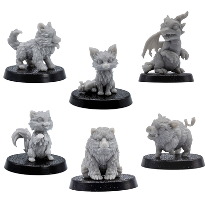 Unpainted set of six Fantasy Familiars showing the puppy, fox, cat, baby boar, bear cub, and wyrmling.