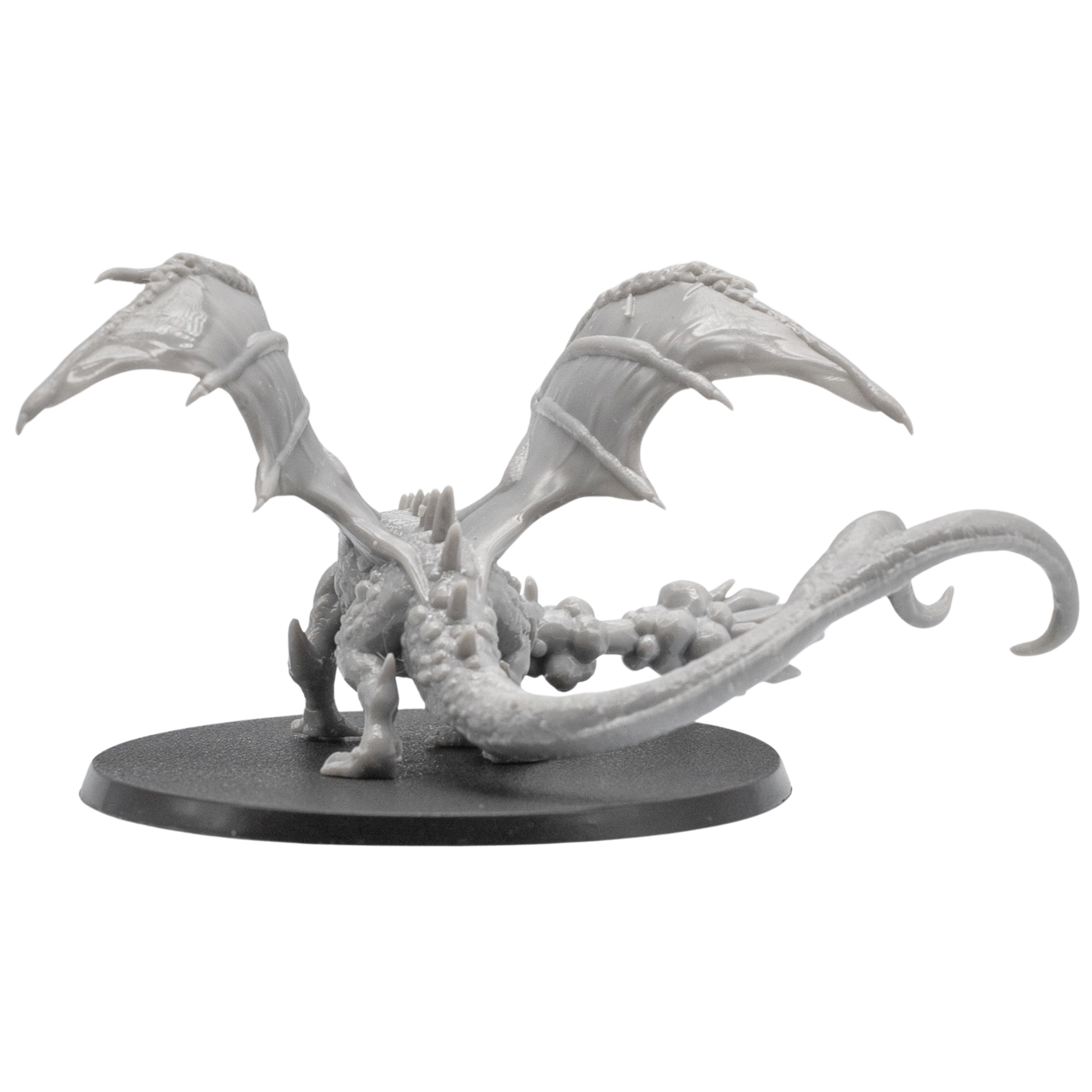 Back view of the Fire Breathing Crystal Dragon miniature showing wide wings, curling tail, rear sculpt detail, and 120mm x 92mm oval base.