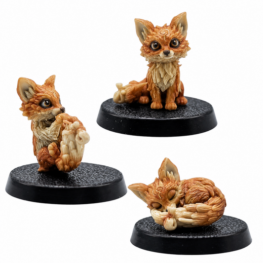 Painted Fox Familiars by Forged Path Miniatures showing three cute fox miniatures on round bases.