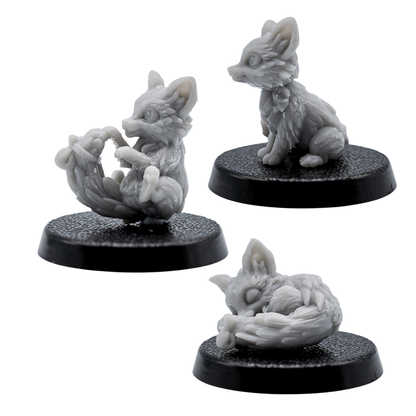 Side views of the unpainted Fox Familiars miniatures by Forged Path Miniatures on 25mm bases.
